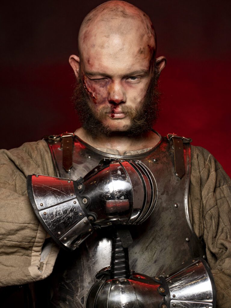 A bloodied knight created through makeup artistry