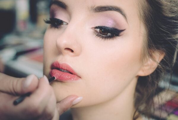 Aspiring makeup artist practicing techniques at CMU College Canada
